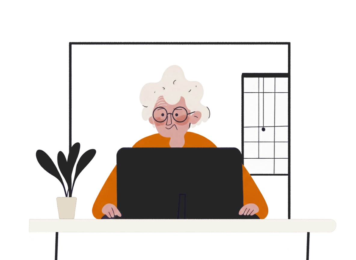 Image of elder person sitting in front of the computer
